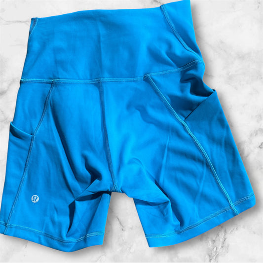 TEAL LULULEMON SHORTS, 6