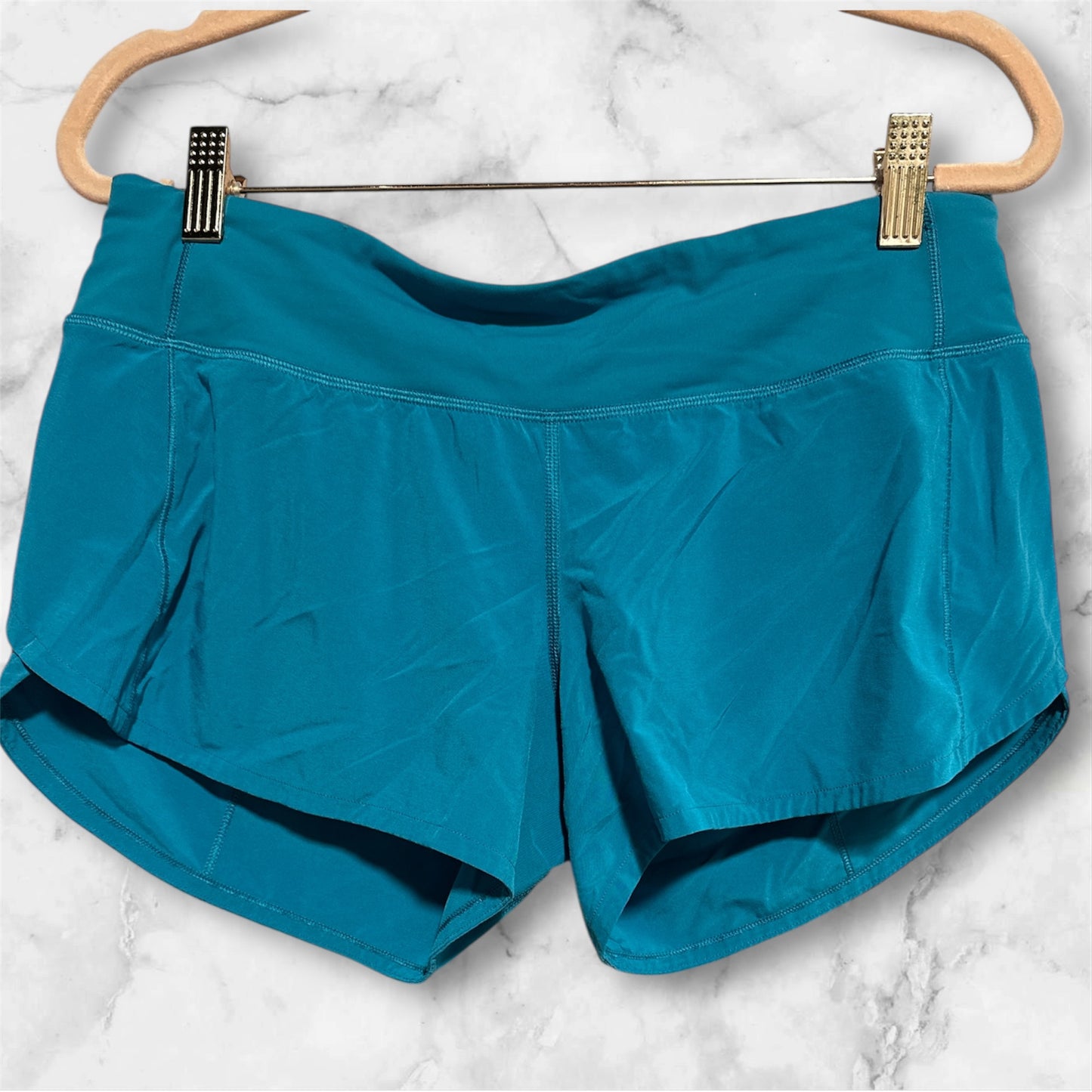 TEAL LULULEMON SHORTS, 6 T
