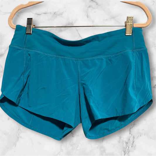 TEAL LULULEMON SHORTS, 6 T