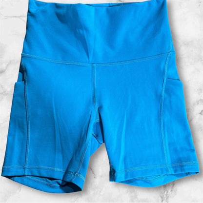 TEAL LULULEMON SHORTS, 6